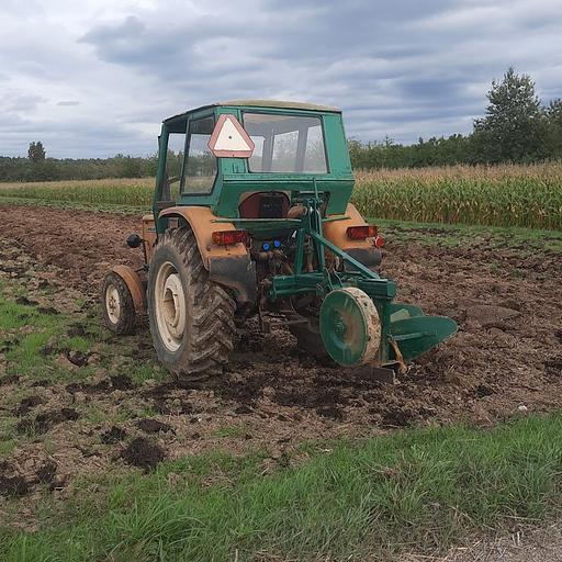 Photo of the rear of the Ursus-C360 with the plow attached.jpg